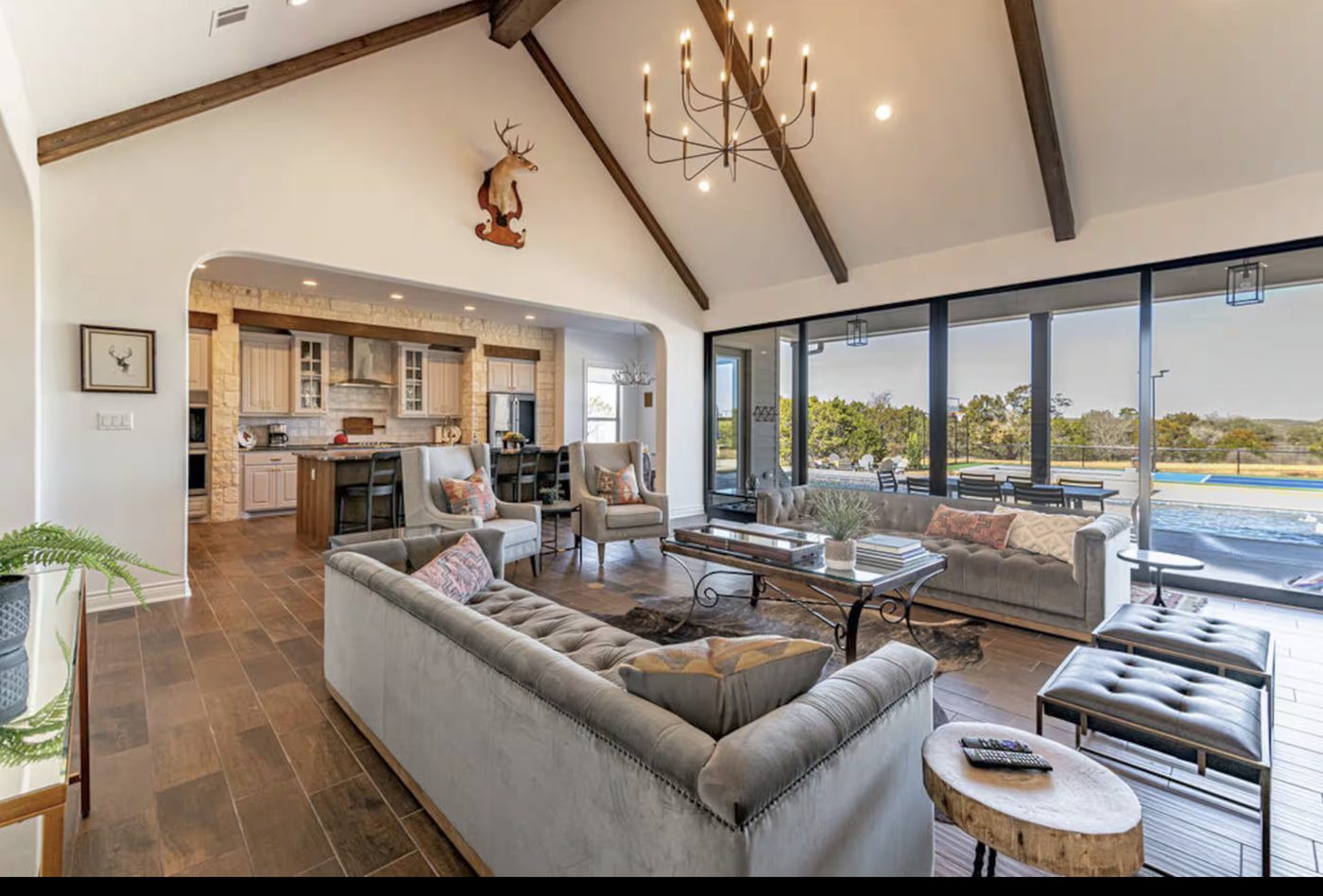 Spacious living room opening to the kitchen and the view